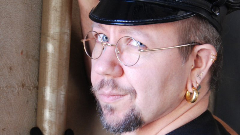 An image of Lee Harrington wearing a Leather cap.